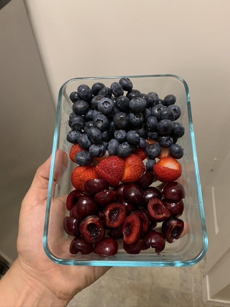 Blueberries, strawberries, and sliced in half cherries with pits removed.